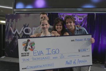 Eva Igo presented with check in hometown