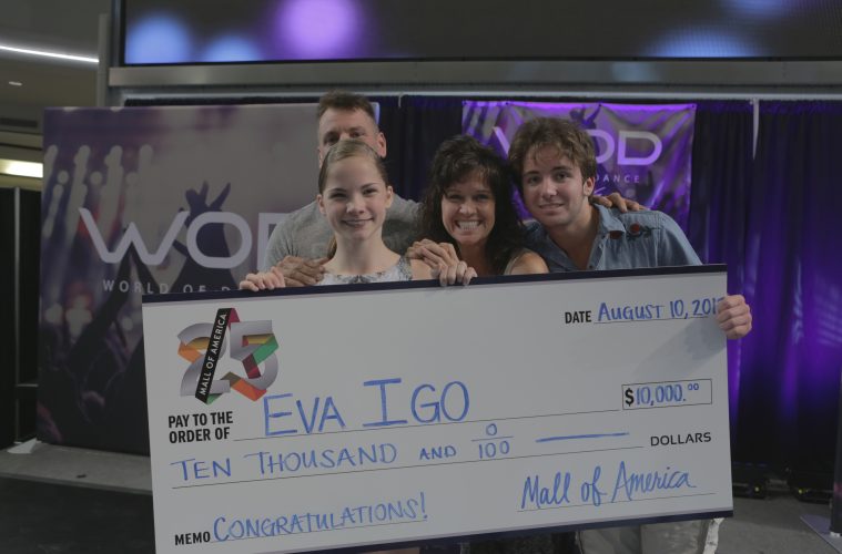 Eva Igo presented with check in hometown