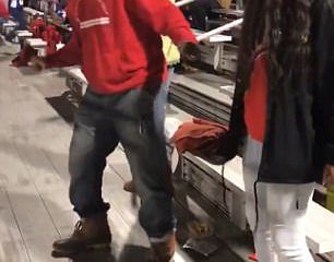 Dad dancing in the bleachers