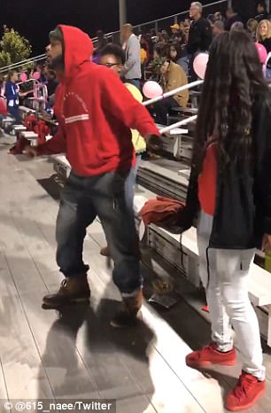 Dad dancing in the bleachers